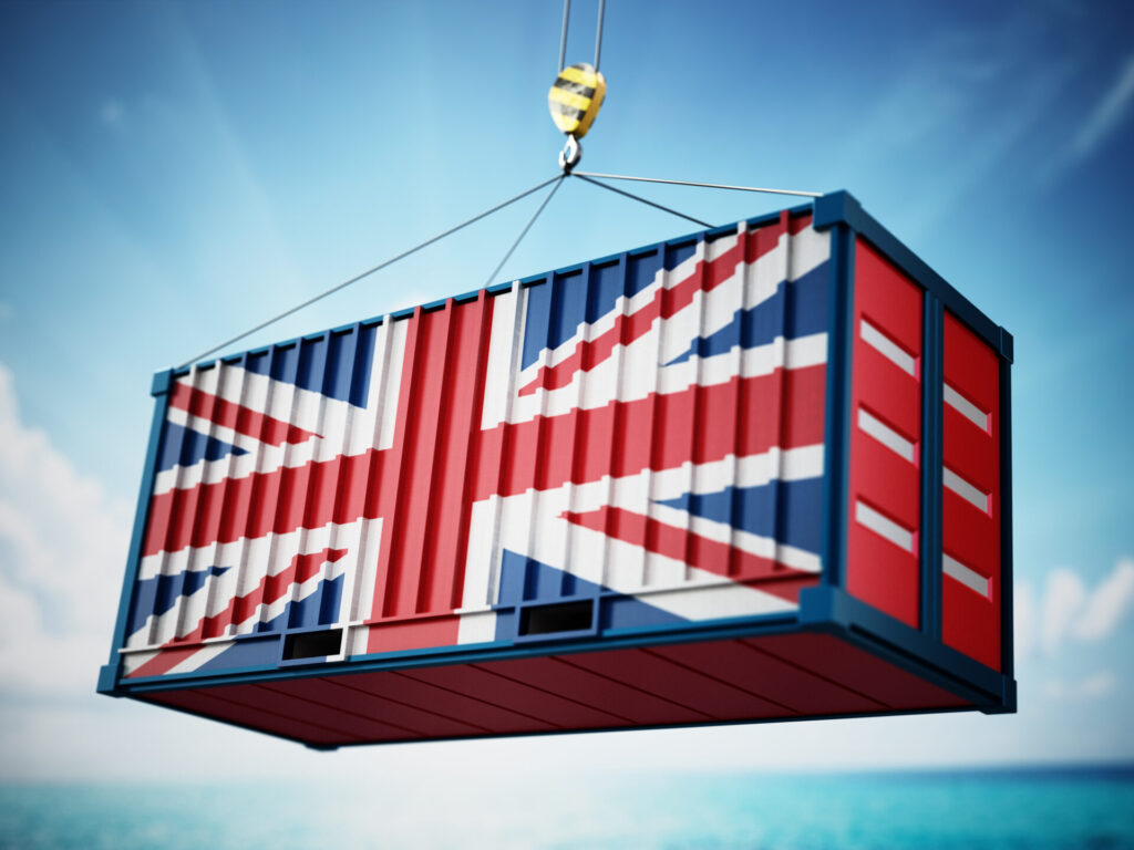 Nearshoring Cargo container with flag of Britain against blue sky. 3D illustration